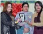  ?? APP ?? Known TV artist Laila Zuberi giving away trophy to winners of English Drama Competitio­n at a college in connection with golden jubilee celebratio­ns in Islamabad on Friday. —
