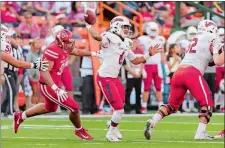  ?? EUGENE TANNER/AP PHOTO ?? Fresno State quarterbac­k Marcus McMaryion (6) throws a pass while playing against Houston in the Hawaii Bowl on Sunday at Honolulu.