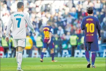  ?? GETTY IMAGES ?? Ronaldo and Messi on during a La Liga match between Real Madrid and Barcelona on December 23, 2017 in Madrid, Spain.