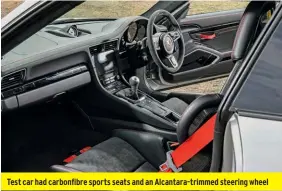  ??  ?? Test car had carbonfibr­e sports seats and an Alcantara-trimmed steering wheel