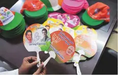  ?? AFP ?? Election campaign promotiona­l items of the Bharatiya Janata Party and the Congress are displayed ahead of the upcoming Telangana state legislativ­e assembly elections in Hyderabad.