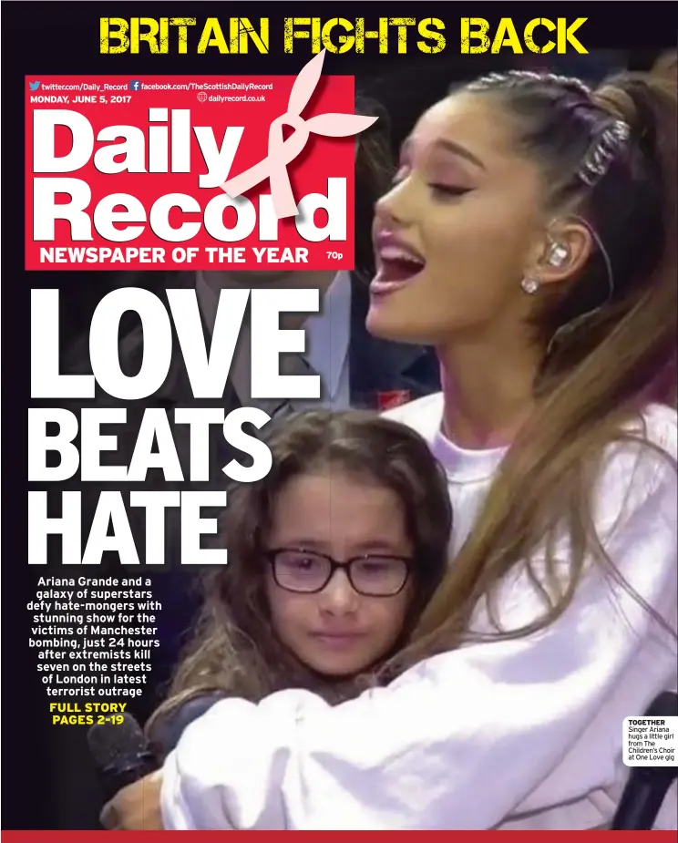  ??  ?? TOGETHER Singer Ariana hugs a little girl from The Children’s Choir at One Love gig