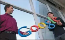  ?? THE ASSOCIATED PRESS ?? In this Jan. 15, 2004, file photo, Google co-founders Larry Page, left, and Sergey Brin pose for a photo at their company’s headquarte­rs in Mountain View, Calif.