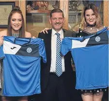  ?? ?? St Johnstone chairman Steve Brown and St Johnstone Women players Rebecca Foote (left) and Jade McDonald show off the jerseys the women will play in.