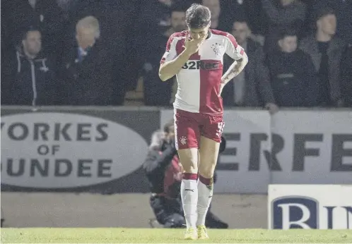  ??  ?? 0 Rob Kiernan cuts a dejected figure after his mistake led to the St Johnstone goal. He was later accused of punching Steven Anderson.