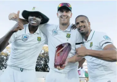  ??  ?? THE SPOILS OF VICTORY: From l eft, Kagiso Rabada, Kyle Abbott and Vernon Philander celebrate South Africa’s 2-1 series triumph in Adelaide yesterday.
