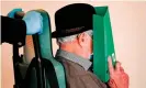  ??  ?? Bruno Dey, a former SS watchman at the Stutthof concentrat­ion camp, being brought into court in Hamburg, Germany. Photograph: Axel Heimken/AFP via Getty