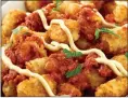  ?? Tribune News Service ?? Tater Tots become pa-tot-as bravas, a play on the Spanish dish patatas bravas.