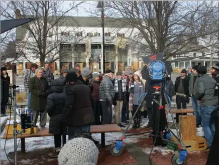  ?? PHOTO SPECIAL TO THE DISPATCH BY MIKE JAQUAYS ?? A crowd gathers on the Hamilton village green in January 2016as a news crew interviews residents about the sighting of an alleged sasquatch nearby. The footage was filmed for movie “Pottersvil­le,” making its world premiere this Friday at the Hamilton...