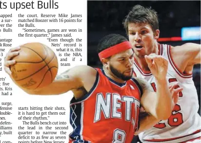  ??  ?? Out of the way: New Jersey Nets’ Deron Williams (left) trying to get past Chicago Bulls’ Kyle Korver during their NBA game in Chicago on Saturday.