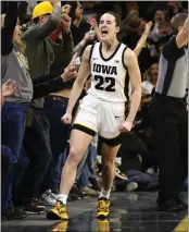  ?? MATTHEW HOLST — GETTY IMAGES/TNS ?? Iowa's Caitlin Clark celebrates after breaking the NCAA women's all-time scoring record on Thursday night.