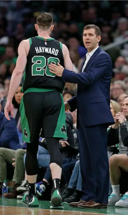  ?? STuART CAHILL / HeRALd sTAFF FILe ?? DEFENSE FIRST: Celtics coach Brad Stevens and forward Gordon Hayward are focusing on peaking at the right time with the NBA set to return July 31.