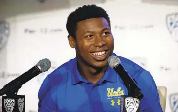  ?? Photograph­s by Marcio Jose Sanchez Associated Press ?? UCLA SENIOR running back Joshua Kelley, f lashing his trademark smile at Wednesday’s Pac-12 media day, says he has three areas in which he wants to get better: pass protection, route running, and ball security.