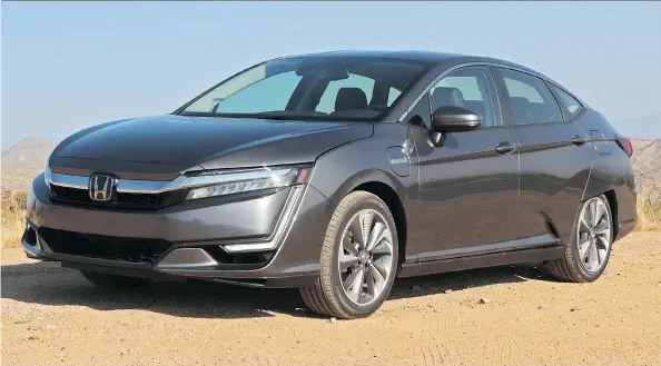  ?? PHOTOS: GRAEME FLETCHER/DRIVING ?? New for 2018, the Honda Clarity plug-in hybrid is the epitome of the new wave in electric hybrid vehicles — easy on the eyes and the wallet.