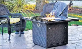  ?? OUTLAND LIVING ?? The popularity of outdoor fire features has grown steadily over the past decade as more homeowners want to add magnetic warmth to their yards.