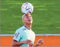  ?? (AFP) ?? Brazil’s forward Richarliso­n plays with the ball during a training session at the Continassa training ground in Turin recently.