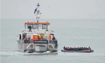  ?? Photograph: Gareth Fuller/PA ?? A group of people in a dinghy are rescued by a Border Force boat near Folkestone in Kent on Saturday.