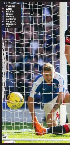  ??  ?? THREE AND EASY: Barrie McKay acclaims his goal, Rangers’ third