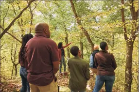  ?? Better Place Forests / Contribute­d photo / ?? Better Place Forests, a California-based company that offers families an alternativ­e memorial burial place for their loved ones, recently expanded to Falls Village with a 130-acre forest area. Above, a family visits a chosen site.