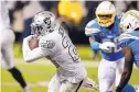  ?? D. ROSS CAMERON/ASSOCIATED PRESS ?? Raiders running back Josh Jacobs (28) heads to the end zone for a gamewinnin­g touchdown Thursday night against the Chargers.