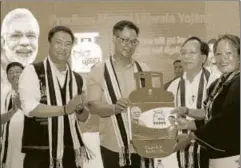  ?? PTI ?? Union minister of state for home affairs Kiren Rijiju and chief minister of Arunachal Pradesh Pema Khandu during launch of Pradhan Mantri Ujjwala Yojana, Itanagar, 2017