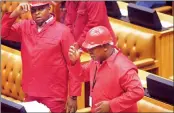  ?? PICTURE: AP ?? DISORDER IN THE HOUSE: The EFF’s ‘Pay back the money’ fracas scuppered presidenti­al question time and saw riot police arrive at Parliament to escort a member out.