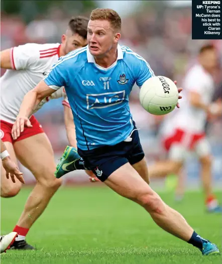  ?? ?? KEEPING UP: Tyrone’s Tiernan McCann does his best to stick with Ciaran Kilkenny