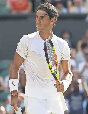  ?? MATTHEW STOCKMAN/GETTY IMAGES ?? Rafael Nadal looks on during his men’s singles first-round match against Dudi Sela of Israel on day two of Wimbledon at the All England Lawn Tennis and Croquet Club.