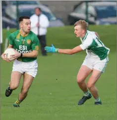  ??  ?? Dunlavin’s Daniel Dawson in action against Donard’s Sean Branigan.