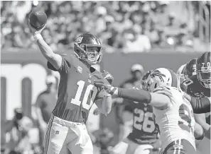  ?? VINCENT CARCHIETTA/ USA TODAY SPORTS ?? In the Giants’ first two games this season, Eli Manning had completed 62.9% of his passes and thrown two TD passes.