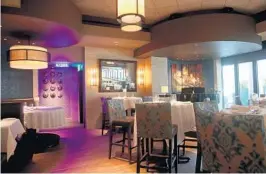  ??  ?? Eddie V’s restaurant in the 100 Las Olas tower in downtown Fort Lauderdale. AMY BETH BENNETT/SUN SENTINEL