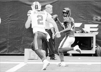  ?? MICHAEL WYKE
THE ASSOCIATED PRESS ?? Texans cornerback Johnathan Joseph, right, scores after intercepti­ng a pass by Buffalo Bills quarterbac­k Nathan Peterman pass in National Football League action Sunday in Houston. The Texans won, 20-13.