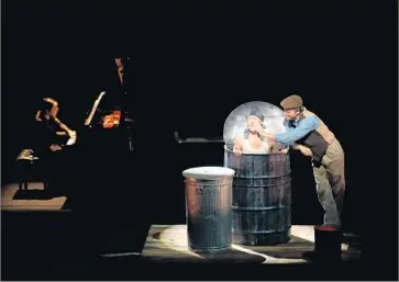  ?? Craig T. Mathew Mathew Imaging ?? A BECKETT-LIKE trash can is used in the staging of a Schubert song at the “Night and Dreams” recital.