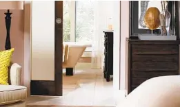  ?? JOHNSON HARDWARE ?? Pocket doors will save floor space, which is par ticularly essential in bathrooms, where space is often tight.