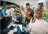  ?? JONATHAN NACKSTRAND/GETTY-AFP ?? Volunteers at Stockholm’s Central Mosque and the adjacent Katarina Church help register refugees last week.