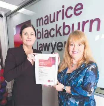  ?? ?? Maurice Blackburn’s Claire Gibbs presents former bus driver Amie Logsdon with a social justice award after she was unfairly dismissed by Surfside Buslines for dealing with an abusive passenger during the Covid-19 pandemic. Picture: Richard Gosling