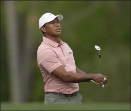  ?? GEORGE WALKER IV — THE ASSOCIATED PRESS ?? Tiger Woods watches his tee shot on the 12th hole during the first round at Augusta National Golf Club Thursday in Augusta, Ga.