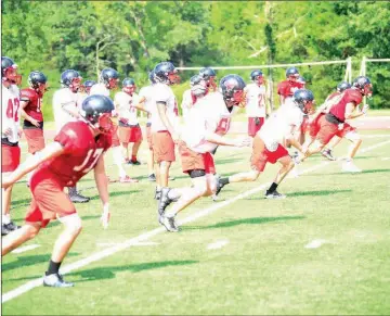  ?? WILLIAM HARVEY/RIVER VALLEY & OZARK EDITION ?? Members of the Russellvil­le football team run sprints following a practice this summer. The Cyclones won the Class 6A state championsh­ip last year.