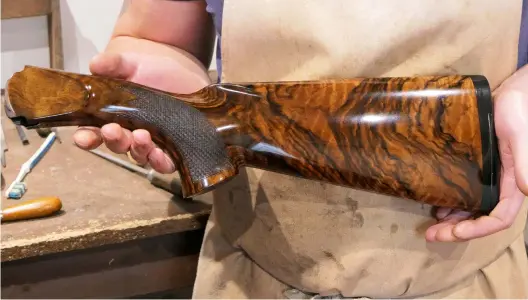  ??  ?? Left: Shane Scase oiling a stock in his home workshop. Above: a London Best could require up to 30 coats. Right: applying his secret formula