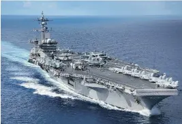  ?? MCSPC 2ND CLASS Z.A. LANDERS / AFP / US NAVY ?? The Navy aircraft carrier USS Carl Vinson is within striking range of North Korea “if the president were to call on it,” according to Adm. Harry Harris Jr.