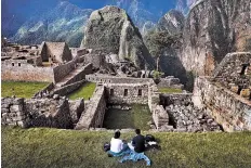  ?? PIOTR REDLINSKI/NEW YORK TIMES ?? Visitors in 2011 at the Incan citadel of Machu Picchu in Peru. The Inca city is believed to have been built in the 15th century and consists of imposing stone buildings arranged around a central plaza. The Incan empire would be one of many topics...