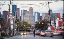  ?? File photo ?? A pedestrian crosses Westheimer Road in Houston recently.