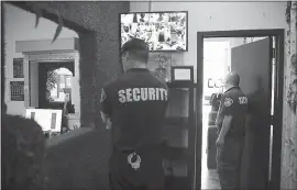  ?? JAE C. HONG — THE ASSOCIATED PRESS ?? Security guards on duty at the Higher Path medical marijuana dispensary owned by Jerred Kiloh in Los Angeles recently. Kiloh’s dispensary on a busy commercial strip is a target for robbers — it’s been hit twice, once by burglars who broke in through the roof.
