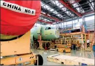  ?? Bloomberg News/NELSON CHING ?? Fuselages for Airbus SAS A320 airplanes sit on an assembly line at the company's assembly plant in Tianjin, China. The nation is investing in industries that officials believe have strong economic potential.