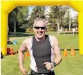  ?? Shaughn Butt s/ Edm. Journal , File ?? Miles Gibson, 53, is all smiles as he completes the 28th annual Coronation Triathlon on May 26, 2012. It was Gibson’s first triathlon.