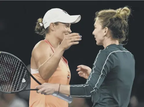  ??  ?? 0 World No 1 Ashleigh Barty, left, hugs Simona Halep after their singles match at the A Day at the Drive exhibition event in Adelaide