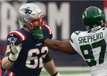 ??  ?? WILL BE MISSED: Patriots left guard Joe Thuney blocks Jets defensive end Nathan Shepherd on Jan. 3 in Foxboro. The Patriots declined to apply the franchise tag on Thuney before Tuesday’s deadline, all but ensuring he will sign elsewhere.