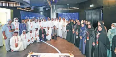  ?? ?? ↑
Dewa’s officials and volunteers during the Expo 2020 Dubai.