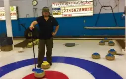  ?? TIM JOHNSON ?? Star contributo­r Tim Johnson stands on the rings during a drop-in curling event.