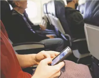  ??  ?? The Federal Communicat­ions Commission might be ready to permit cellphone calls in flight. If allowed, airlines would have to revisit the issue.